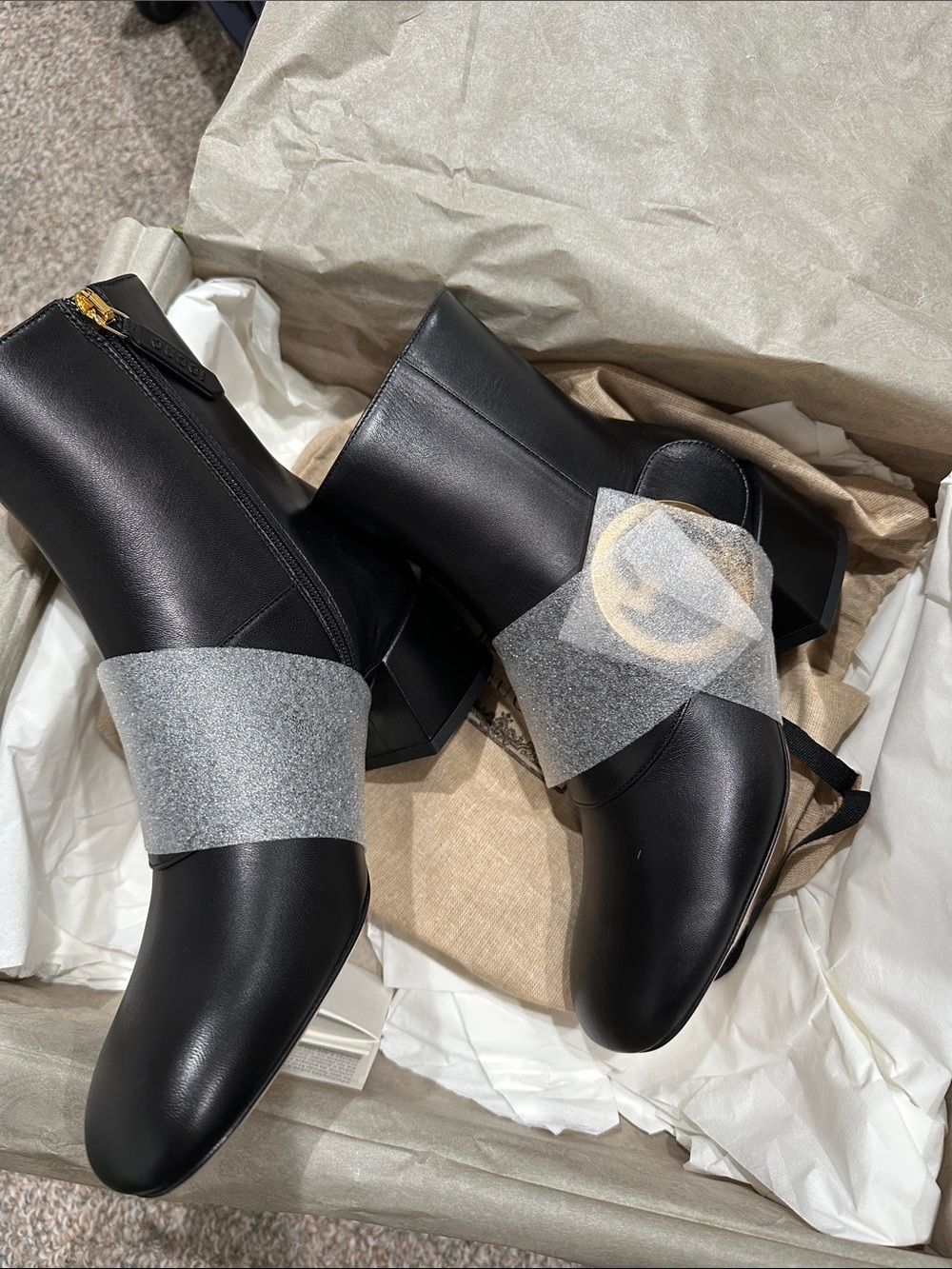 Gucci Black Leather Ankle Boots with Gold Zip and Heel Accent